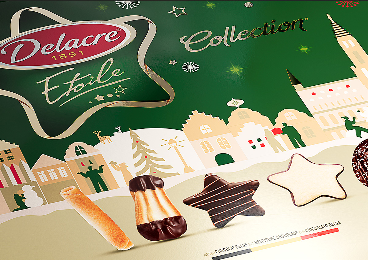 Dettaglio della confezione Delacre Étoile Collection con biscotti a forma di stella e lingue di gatto ricoperte di cioccolato davanti a un paesaggio urbano invernale illustrato