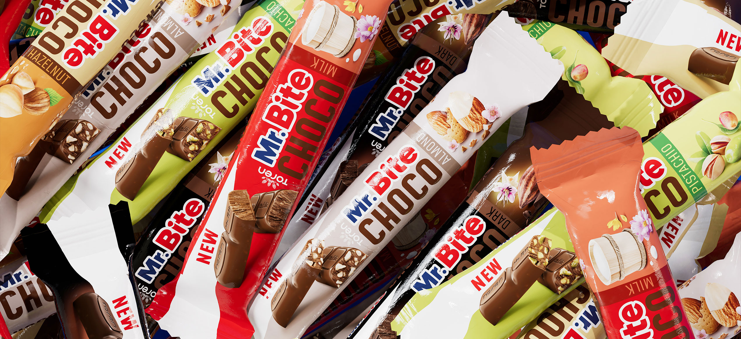 Panoramica di barrette Mr. Bite Choco in diversi gusti su sfondo colorato