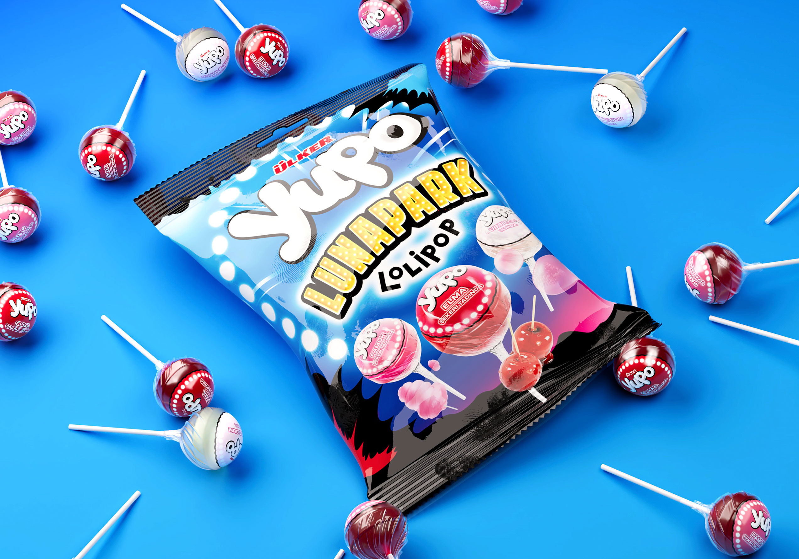 Pack Yupo Lunapark Lollipop al centro circondato da lecca-lecca sparsi, su sfondo blu vivace con luci effetto “lunapark”